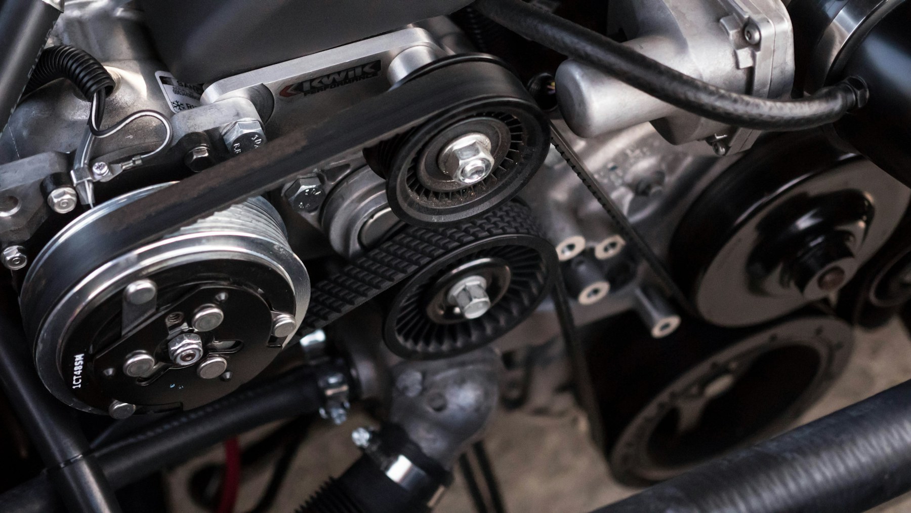 Technician servicing a vehicle in a professional garage